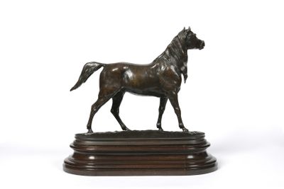 bronze statue of a horse on a wooden base on a white background