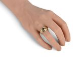 an image of a woman ' s hand with a gold ring on it