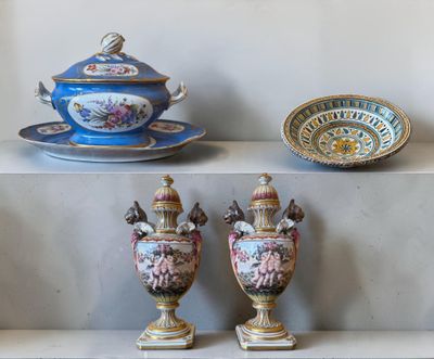 three vases sitting on a shelf next to a bowl and saucer