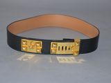 black leather belt with gold metal buckle and nameplates on it