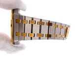 a person holding a watch in their hand on a white background