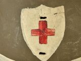 a helmet with a red cross on it and a cross on the side