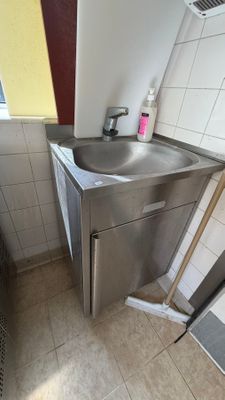 a bathroom with a sink and a toilet in it