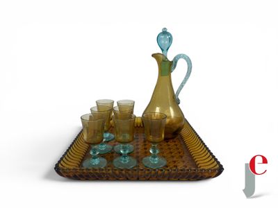 a tray with a pitcher and glasses on it