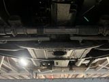 a close up view of a car underneath a vehicle