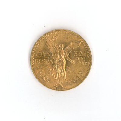 une pièce d'or représentant un ange sur un fond blanc