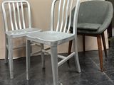two chairs sitting next to each other in a room