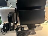 an image of a computer desk with a keyboard and monitor