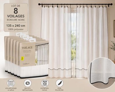 white curtains in a room with a lot of boxes on the floor
