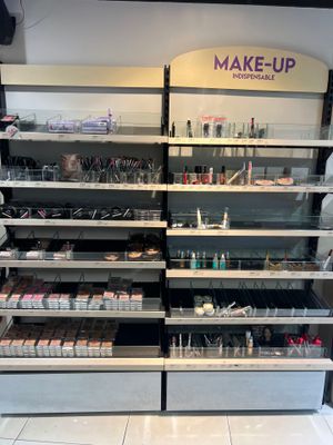 a large display of makeup products in a store