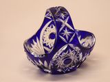 a blue glass vase with a star design on it