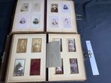 several old photos of people are displayed in an open book
