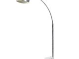 the lamp is on a marble base and has a white marble base