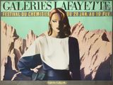 an image of a poster for a concert with a woman standing in front of a mountain