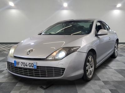 a picture of a silver car parked in a garage