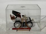 a small model of a car in a clear box