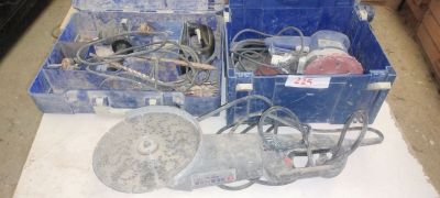 two blue boxes with tools in them on a table