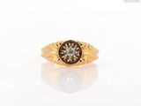 an image of a gold ring with a brown diamond