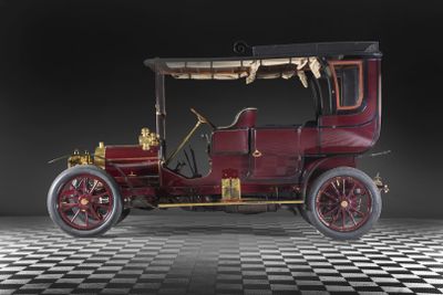 an image of an old model t car on a checkered floor