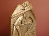 a bronze sculpture of a man and a woman on a bench
