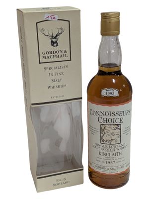 une bouteille de whisky single malt « Gordon's Choice » posée devant une boîte