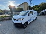 a white van parked in front of a house with the sun shining on it