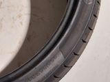 a close up of a tire on a white surface