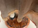 a close up of a table with a lamp on it