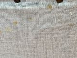 a picture of a piece of fabric with holes in it