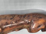 a wooden stick with writing on it on a table