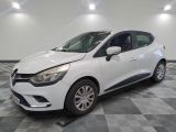 a white car is parked in a room with a checkered floor