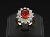 a close up of a red and white diamond ring on a black surface