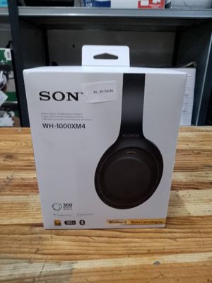 a box with a pair of headphones in it sitting on a table
