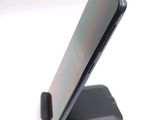 a phone that is sitting on top of a stand