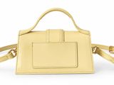 the small square bag in yellow leather