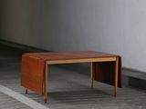a small wooden table sitting on the floor in a room