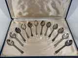 many spoons and spoon spoons in a blue case