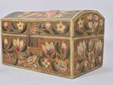 a small wooden box with flowers painted on it