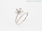 a close up of a ring with a flower on it
