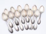 a lot of silver spoons and spoon spoons on a table