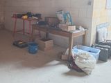 an image of a room with a workbench and tools in it
