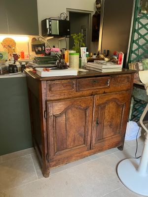 an image of a kitchen with a bar stool and a sink