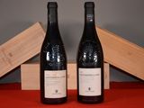 two bottles of wine sitting next to each other on a table