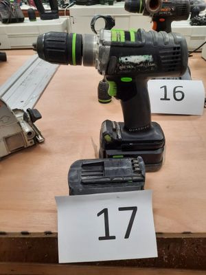 a cordless drill that is sitting on a table