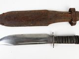 two knives that are sitting next to each other on a table