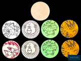 quatre boutons de couleurs différentes, ornés de personnages de dessins animés, sur fond noir