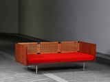 a red couch that is sitting in a room