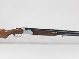 a rifle with a wooden barrel and a wooden muzzle on a white background