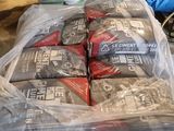 many bags of food sitting on top of a pallet