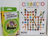 two boxes of games on a table with a white background